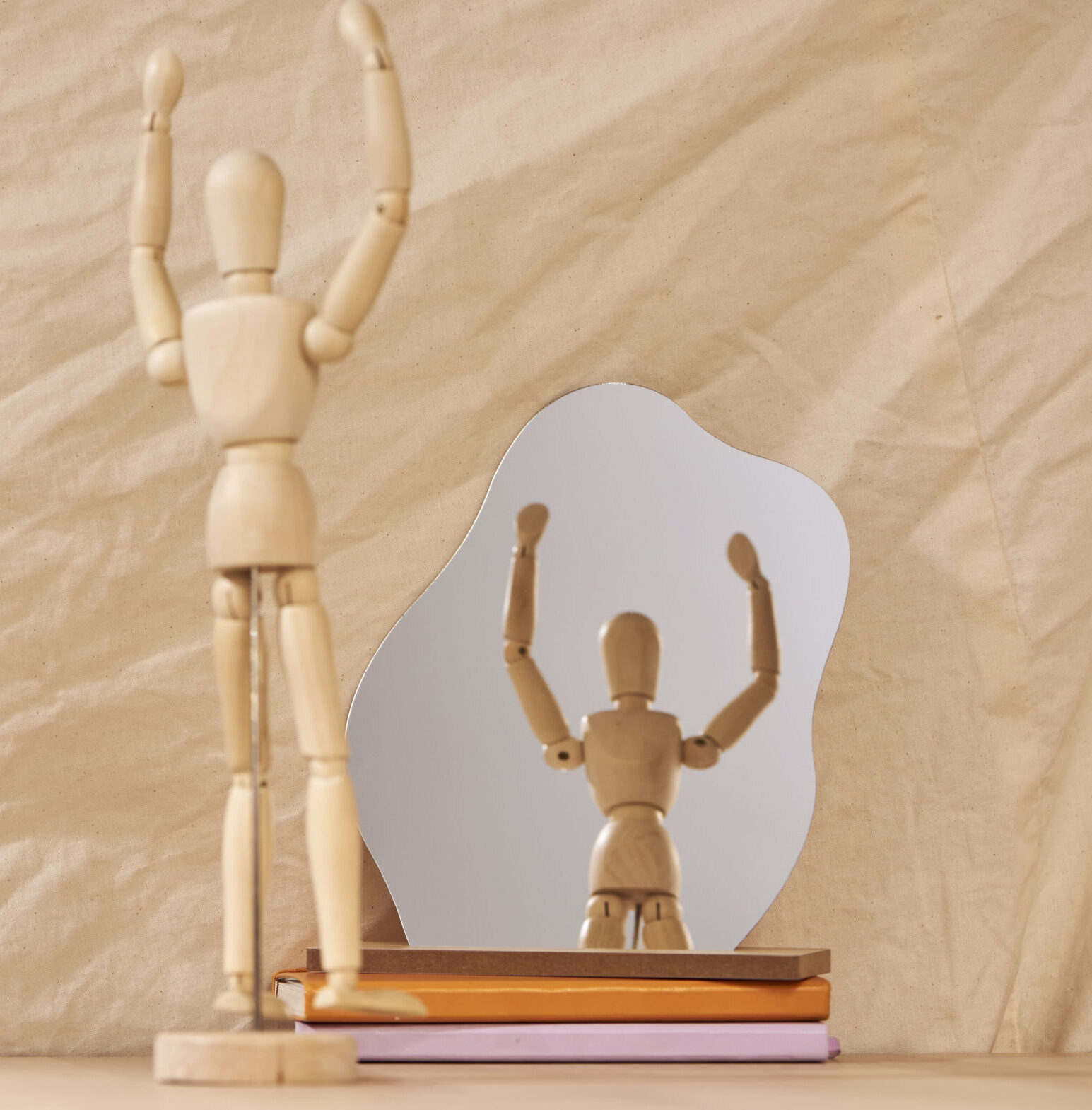 JVH Therapy – Project 2_1816 Wooden figure cheering at self in reflection in the mirror